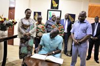 President William Ruto signing the visitors' book at Kakamega Governor Fernandes Barasa's home