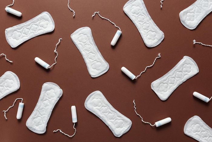 Sanitary towels and tampons on a brown background [Photo: Cliff Booth]