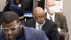 Defendant Billy Chemirmir lowered his mask as a state's witness was asked to identify him during his murder trial at the Frank Crowley Courts Building in Dallas on Nov. 17, 2021. (Tom Fox / Staff Photographer)