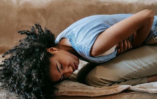 Woman suffering from abdominal pain [Image Credit: Sora Shimazaki]