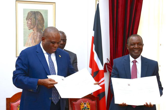 Treasury CS Njuguna Ndung'u and AfriExim President Benedict Oramah signing a Sh400 billion loan at State House on May 2, 2023