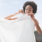 Woman hanging white laundry