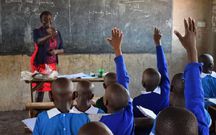 A teacher at Shauri Yako Primary school in Homa Bay town teaches grade four pupils