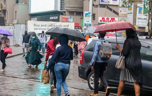 People walking in the rain