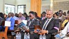 Martin Kasavuli with Sports CS Ababu Namwamba during the funeral service for his mother, the late Catherine Kasavuli