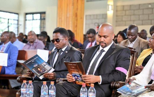 Martin Kasavuli with Sports CS Ababu Namwamba during the funeral service for his mother, the late Catherine Kasavuli