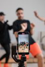 Content creators using a smartphone to shoot their content