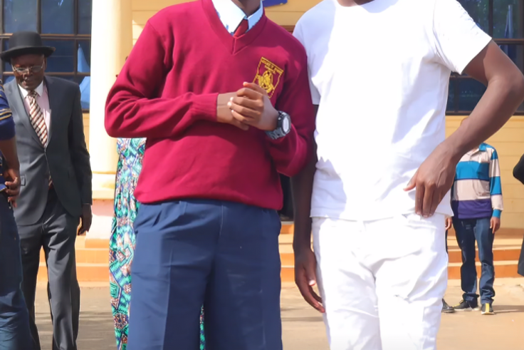 Alex Mathenge and his son during admission to Mang'u High School