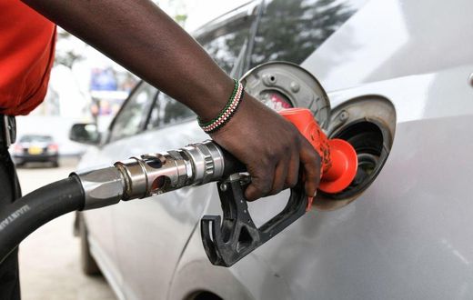 A pump attendant fills the tank of a car at a petrol station in September 4, 2018 in Nairobi as a 16 per cent VAT on petroleum products was decided and fuel distributors refused to collect stocks from depots. (Photo by SIMON MAINA/AFP via Getty Images)