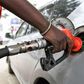 A pump attendant fills the tank of a car at a petrol station in September 4, 2018 in Nairobi as a 16 per cent VAT on petroleum products was decided and fuel distributors refused to collect stocks from depots. (Photo by SIMON MAINA/AFP via Getty Images)