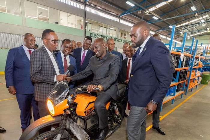 President William Ruto takes a test drive on an electric motorcycle during a visit to Roam Park, an electric motorcycle assembly plant in Industrial Area, Nairobi, July 25, 2023