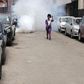 A protestor walks away from teargas during Occupy Parliament protests in Kenya