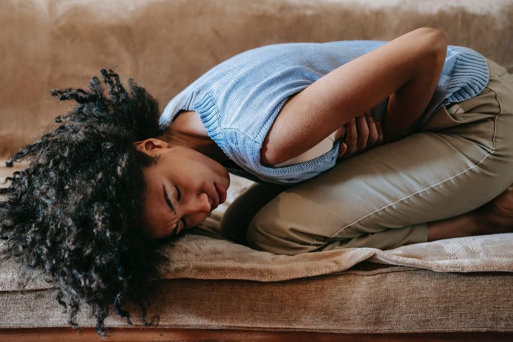 A bloated woman in discomfort