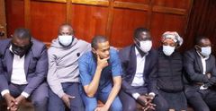Director of Press Service at Office of the Prime Cabinet Secretary Salim Swaleh alongside other suspects in court