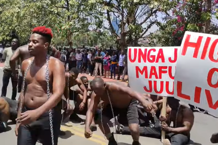 Eric Omondi leads protests outside parliament buildings