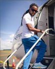 Nyashinski boarding a plane