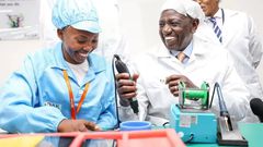 President William Ruto is shown how the smart phones are made at the East Africa Device Assembly Kenya factory in Athi River, Machakos during its launch on October 30, 2023.