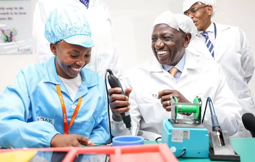 President William Ruto is shown how the smart phones are made at the East Africa Device Assembly Kenya factory in Athi River, Machakos during its launch on October 30, 2023.