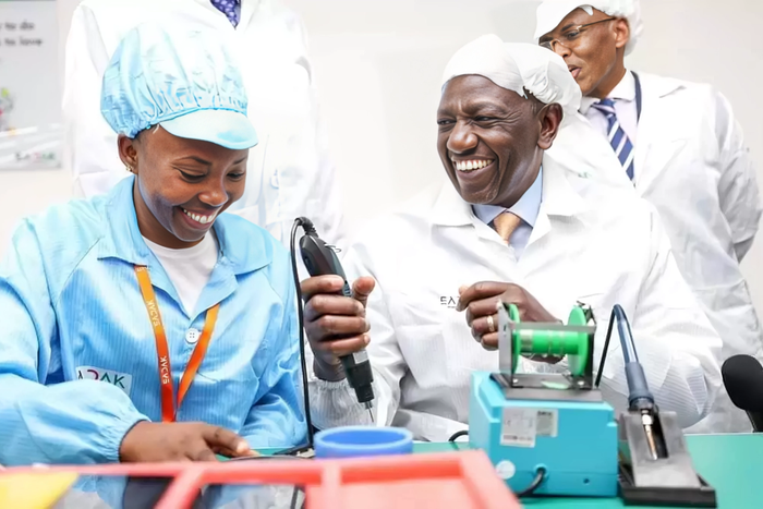 President William Ruto is shown how the smart phones are made at the East Africa Device Assembly Kenya factory in Athi River, Machakos during its launch on October 30, 2023.