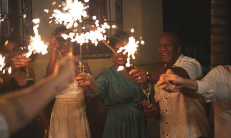 Family and friends celebrating New Year's eve party at home