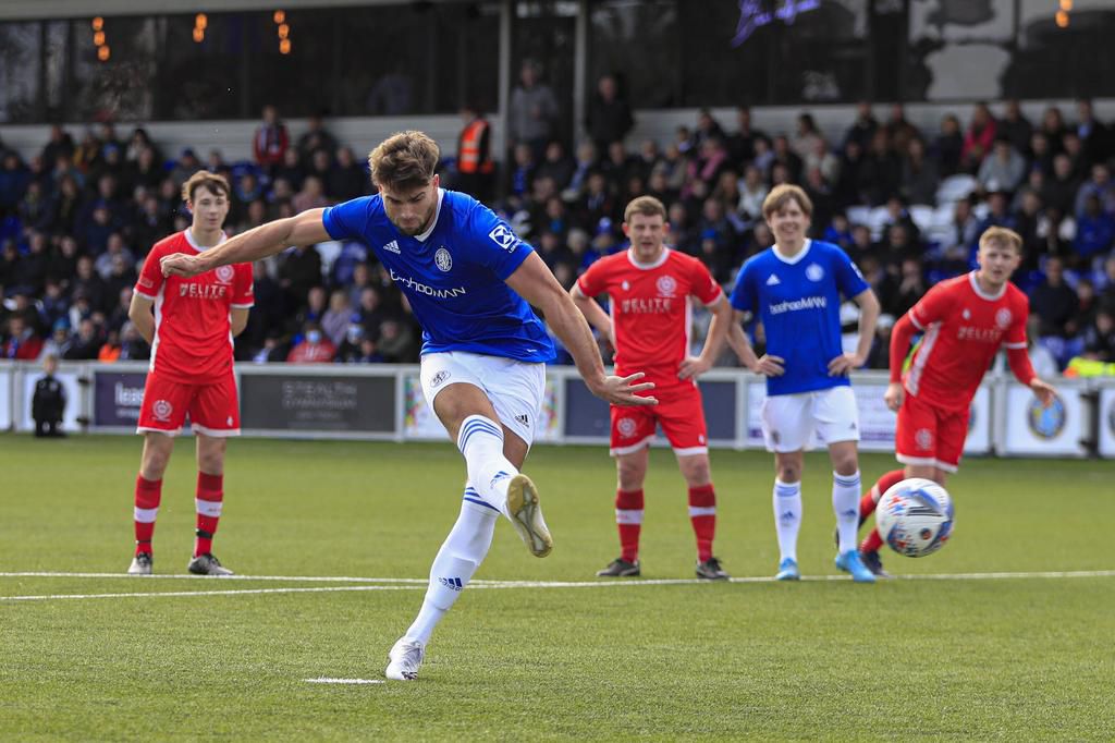 Tom Clare 9 of Macclesfield FC scores from the penalty spot to make it 2-0 against AFC Liverpool on April 2, 2022.