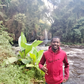 William Maina in a waterfall exploration