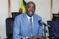 Cabinet Secretary for Education Ezekiel Machogu in his office