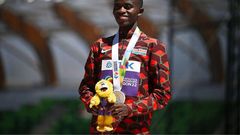 Silver medallist Kenya's Stanley Waithaka Mburu poses on the podium during the medal ceremony for the men's 10,000m during the World Athletics Championships at Hayward Field in Eugene, Oregon on July 17, 2022. (Photo by BEN STANSALL/AFP via Getty Image...