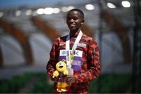 Silver medallist Stanley Waithaka Mburu poses on the podium during the medal ceremony for the men's 10,000m during the World Athletics Championships at Hayward Field in Eugene, Oregon on July 17, 2022. (Photo by BEN STANSALL/AFP via Getty Images)