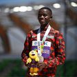 Silver medallist Kenya's Stanley Waithaka Mburu poses on the podium during the medal ceremony for the men's 10,000m during the World Athletics Championships at Hayward Field in Eugene, Oregon on July 17, 2022. (Photo by BEN STANSALL/AFP via Getty Image...