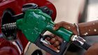 FILE PHOTO: A worker holds a nozzle to pump petrol into a vehicle at a fuel station in Mumbai, India, May 21, 2018. REUTERS/Francis Mascarenhas/File Photo