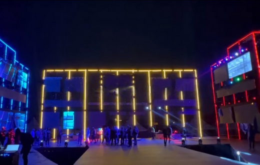 The massive stage, the size of a two-story building, is where everything is going down.