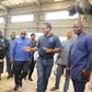 Mr-Kenneth-Akibate-middle-showing-some-of-the-assembled-vehicles-to-President-Akufo-Addo-on-tour-of-the-facility