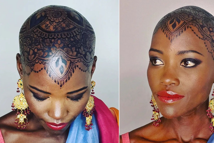 Lupita Nyong'o dorns intricate henna design on her bald head