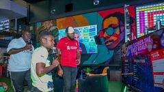 MC Lotan Salapei(left), radio presenter Fred Arocho(center) and MC Eric Njiruanalyzing the predictions on screen during the Guinness brightest matchday madeby the fans at Bar Next Door, Kiambu Road