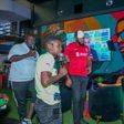 MC Lotan Salapei(left), radio presenter Fred Arocho(center) and MC Eric Njiruanalyzing the predictions on screen during the Guinness brightest matchday madeby the fans at Bar Next Door, Kiambu Road