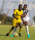 Wazito FC Elli Asieche (left) shields Tusker FC Charles Momanyi on March 8, 2022 during Kenya Premier League match played at Moi International Sportes Centre