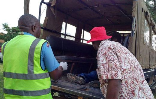 File image of police officers ferrying a dead body.