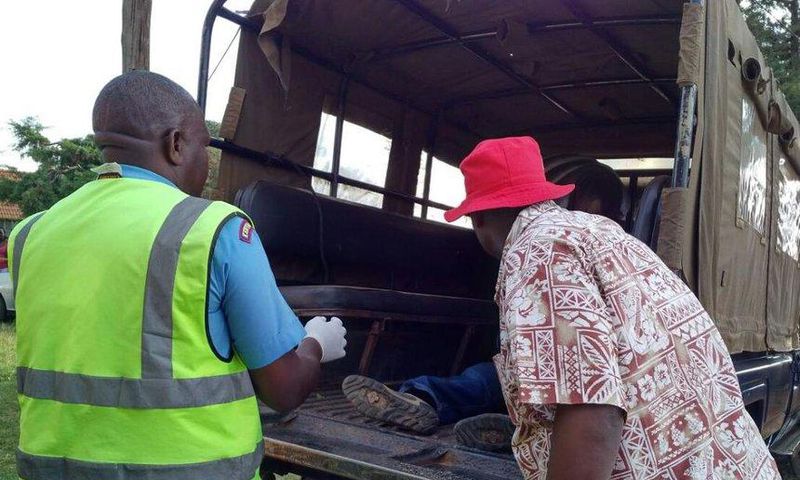 File image of police officers ferrying a dead body.