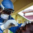 A medical officer takes a sample for the COVID-19 coronavirus at the laboratory of Kenya Medical Research Institute (KEMRI) where they have capacity to test 384 samples per day in Kisumu, western Kenya, on April 23, 2020. - KEMRI (Photo by Brian ONGORO...