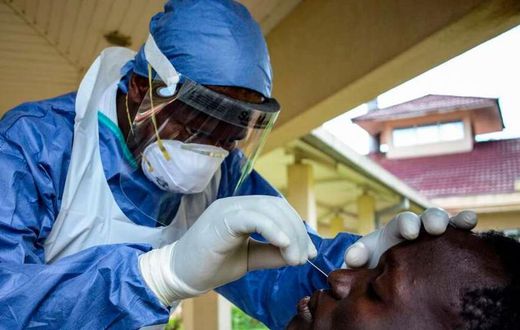 A medical officer takes a sample for the COVID-19 coronavirus at the laboratory of Kenya Medical Research Institute (KEMRI) where they have capacity to test 384 samples per day in Kisumu, western Kenya, on April 23, 2020. - KEMRI (Photo by Brian ONGORO...