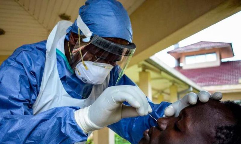 A medical officer takes a sample for the COVID-19 coronavirus at the laboratory of Kenya Medical Research Institute (KEMRI) where they have capacity to test 384 samples per day in Kisumu, western Kenya, on April 23, 2020. - KEMRI (Photo by Brian ONGORO...