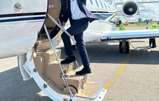 Eddie Butita boarding a plane