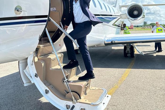 Eddie Butita boarding a plane
