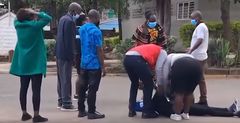 Family member faints at City Mortuary after viewing Josephine's body retrieved from Kware Dam, Mukuru Kwa Njenga