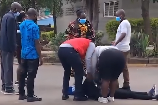 Family member faints at City Mortuary after viewing Josephine's body retrieved from Kware Dam, Mukuru Kwa Njenga