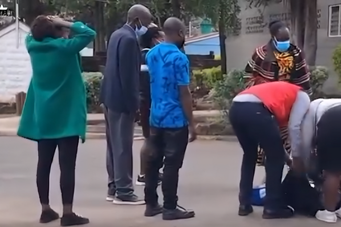 Family member faints at City Mortuary after viewing Josephine's body retrieved from Kware Dam, Mukuru Kwa Njenga