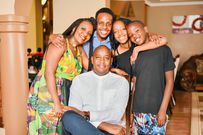 Group Editorial & Strategy Director, Royal Media Services Linus Kaikai with his wife and children