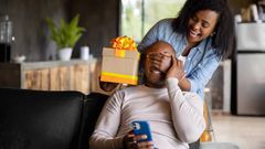 A lady surprising his man with a gift