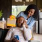 A lady surprising his man with a gift